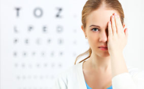 eyesight check. woman at the doctor ophthalmologist optician
