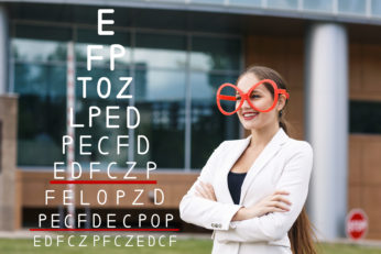 Doctor recording the results an eyesight test on the white background